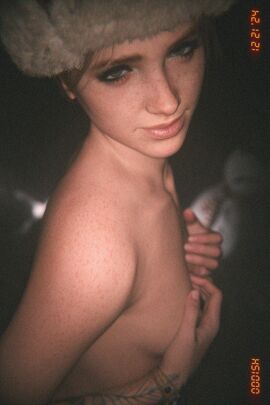 1girls 2024 3d bracelet bracelets breasts covering_breasts covering_self ellie_(the_last_of_us) ellie_williams eyebrow_slit eyeliner female female_only freckles freckles_on_face freckles_on_shoulders fur_hat green_eyes looking_at_viewer mascara medium_breasts nipple_peek nipples odd_3d pink_lipstick solo the_last_of_us the_last_of_us_2 topless topless_female